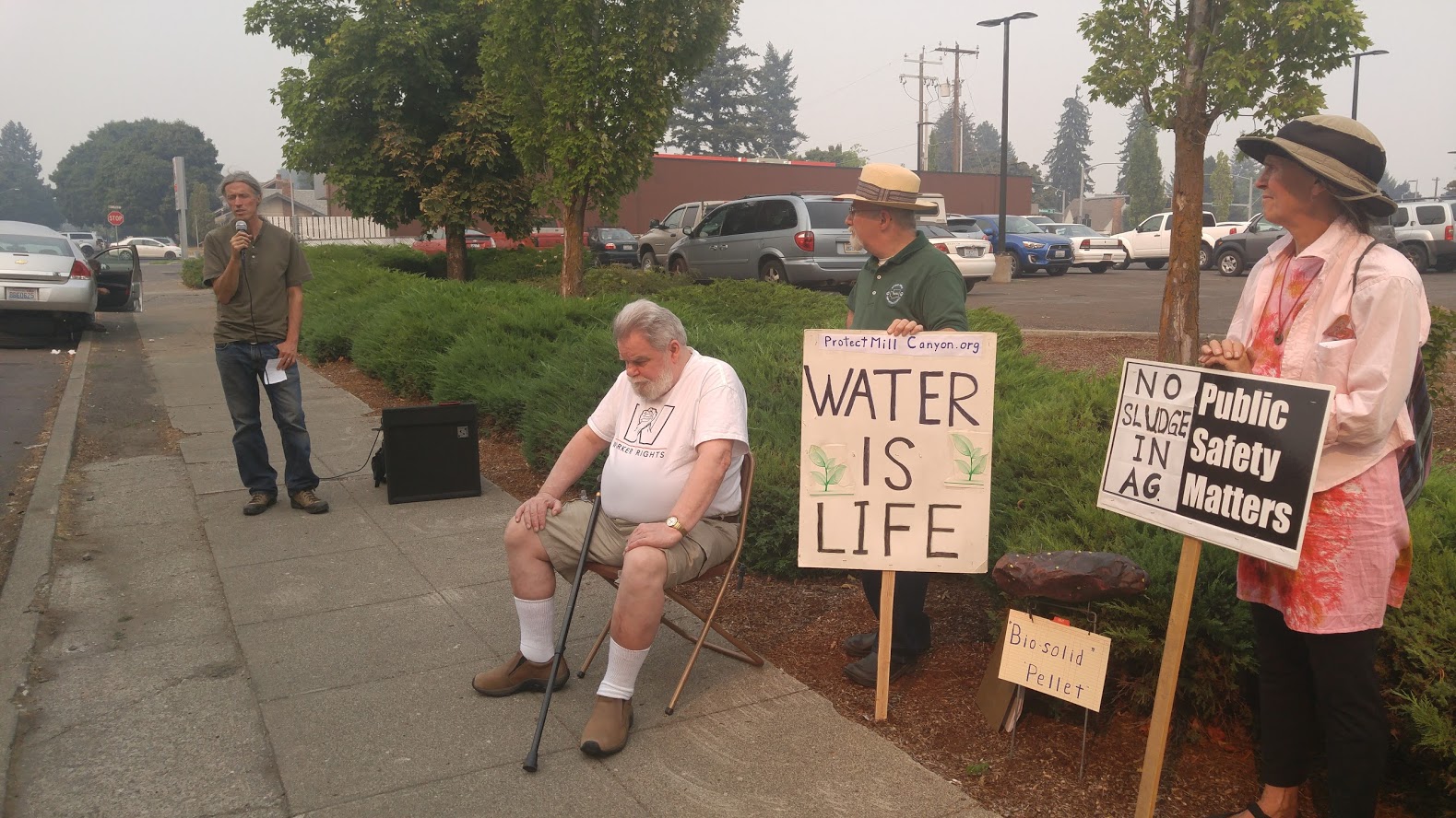 Organic farmer Tim Pellow speaks to a 2017 combo demonstration and press conference organized by Protect Mill Canyon Watershed outside Spokane office of Department of Ecology.